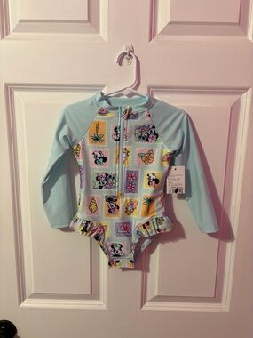 Long-Sleeve Light Blue One-Piece Swimsuit with Playful Tropical Print